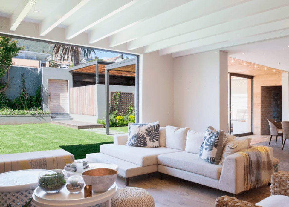 Interior of the living room of a beautiful villa with access to the villa's garden.