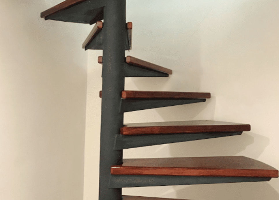 Spiral staircase leading to illegally constructed roof space, detected during a condition survey of an apartment