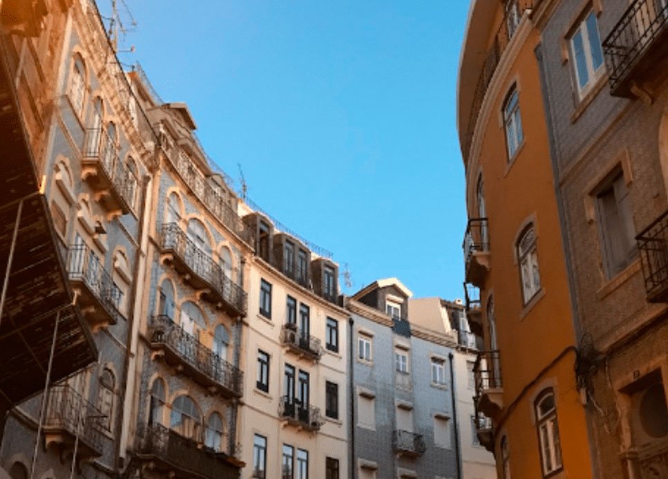 Buildings in Lisbon, Portugal, as seen from the sidewalk.