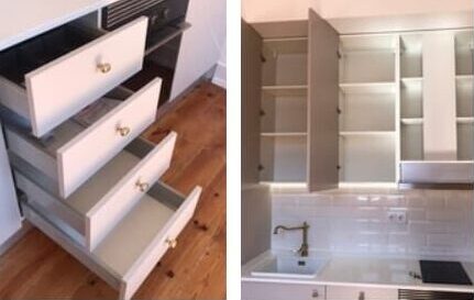 Four open drawers. Kitchen fittings with wall tile background. Door lock and handle, wooden floor and stairs.